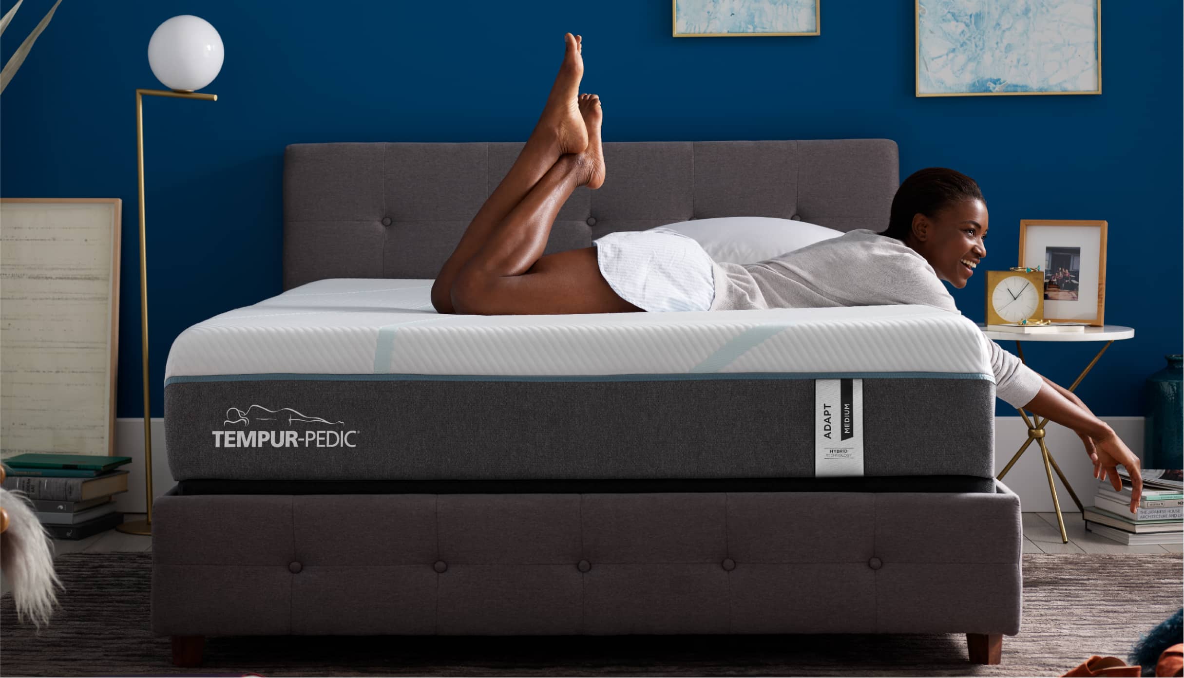 Woman laying on a Tempur-Pedic® mattress.